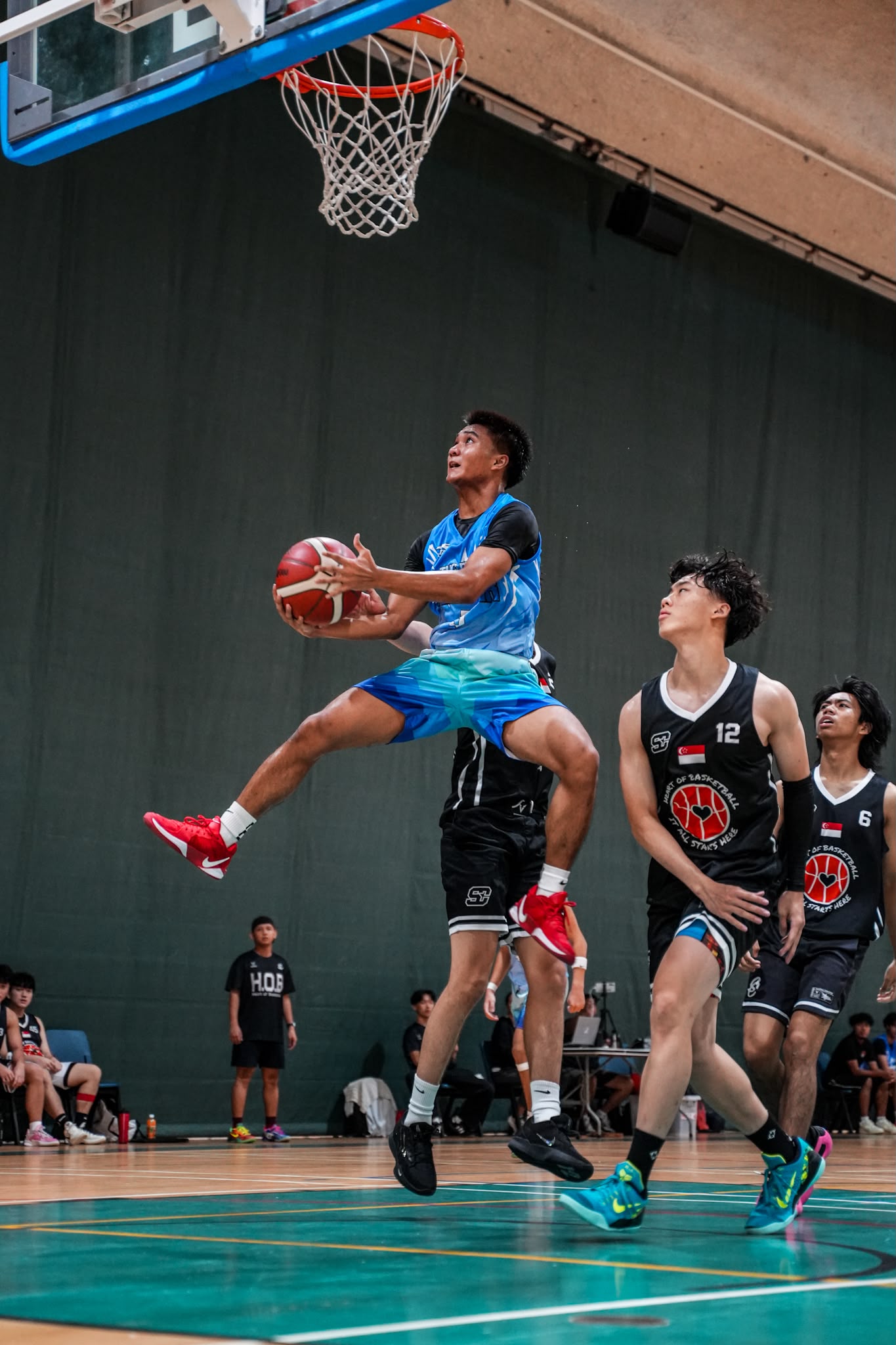 TOH player attacking the basket during competition